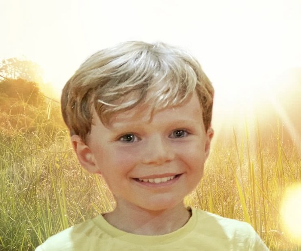 Olivier smiling outdoors